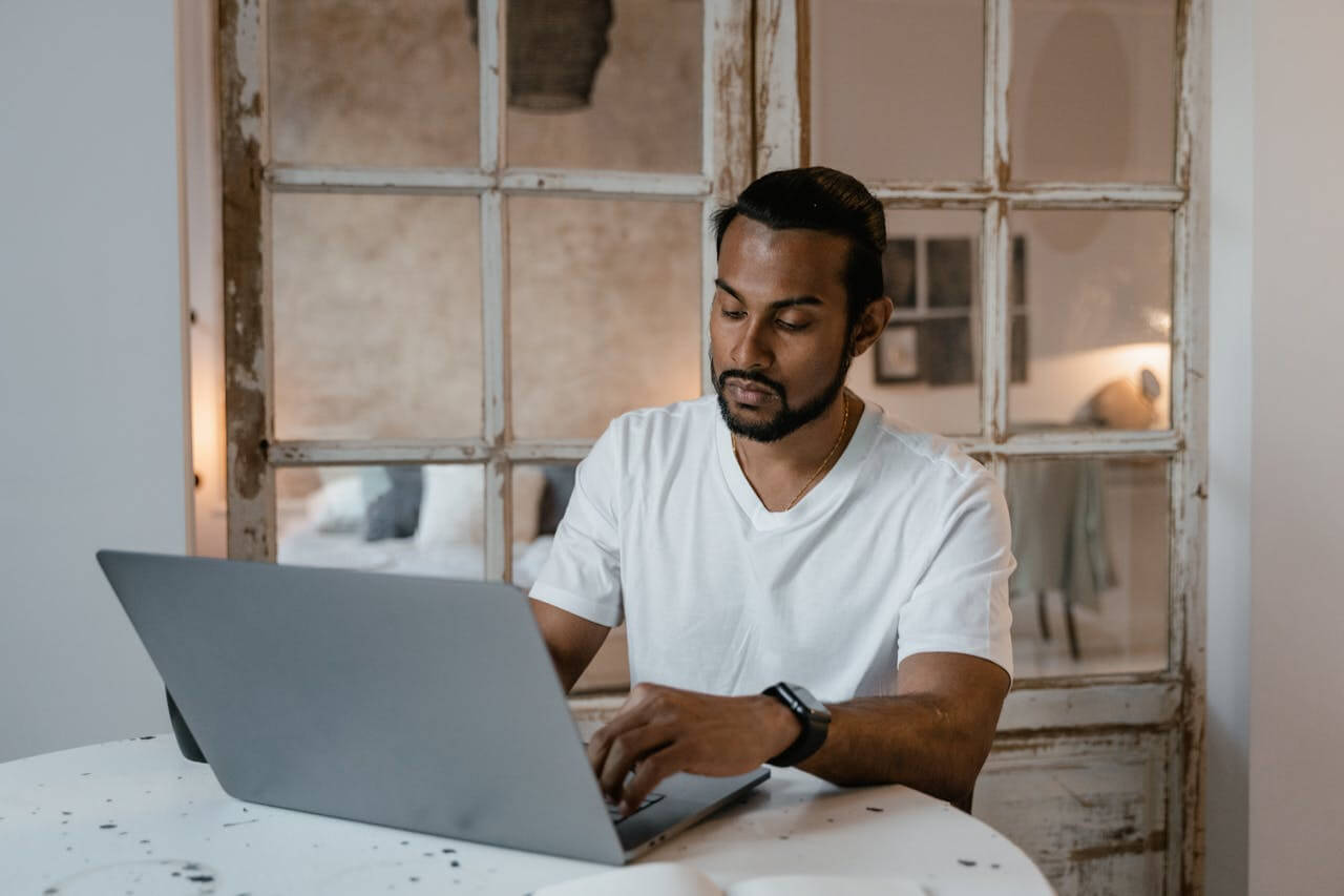 Self-employed UK business owner reviewing Making Tax Digital rules while comparing sole trader and limited company tax structures, focusing on HMRC compliance and digital tax reporting requirements.