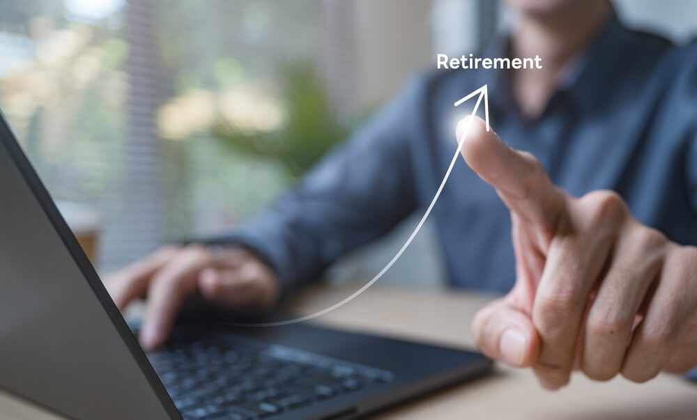 A limited company director reviewing pension contribution options to reduce Corporation Tax and build long‑term retirement savings.